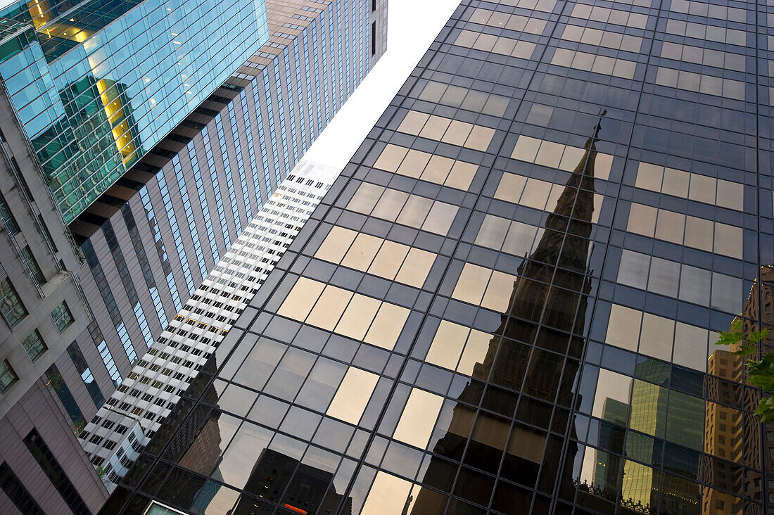 Reflection of St. Patrick's Cathedral on a high rise building, Manhattan, New York, USA, America