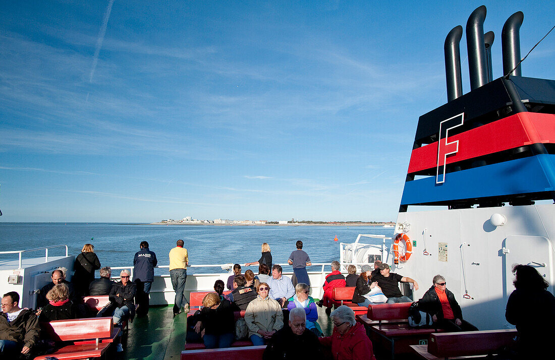 Passengers on ferry to Norderney island, East Frisian Islands, Lower Saxony, Germany