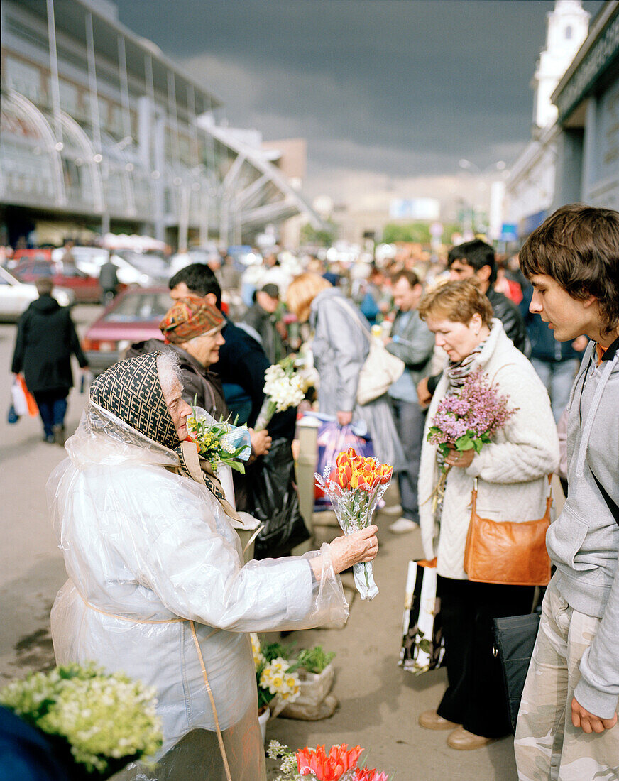 Old women selling flowers at Jevropeski Plaza, european mall, Moscow, Russia, Europe