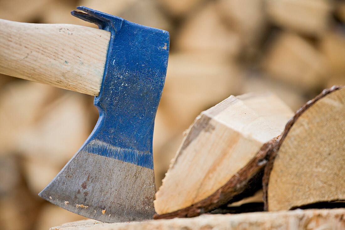 Axe and wood billet on chopping block