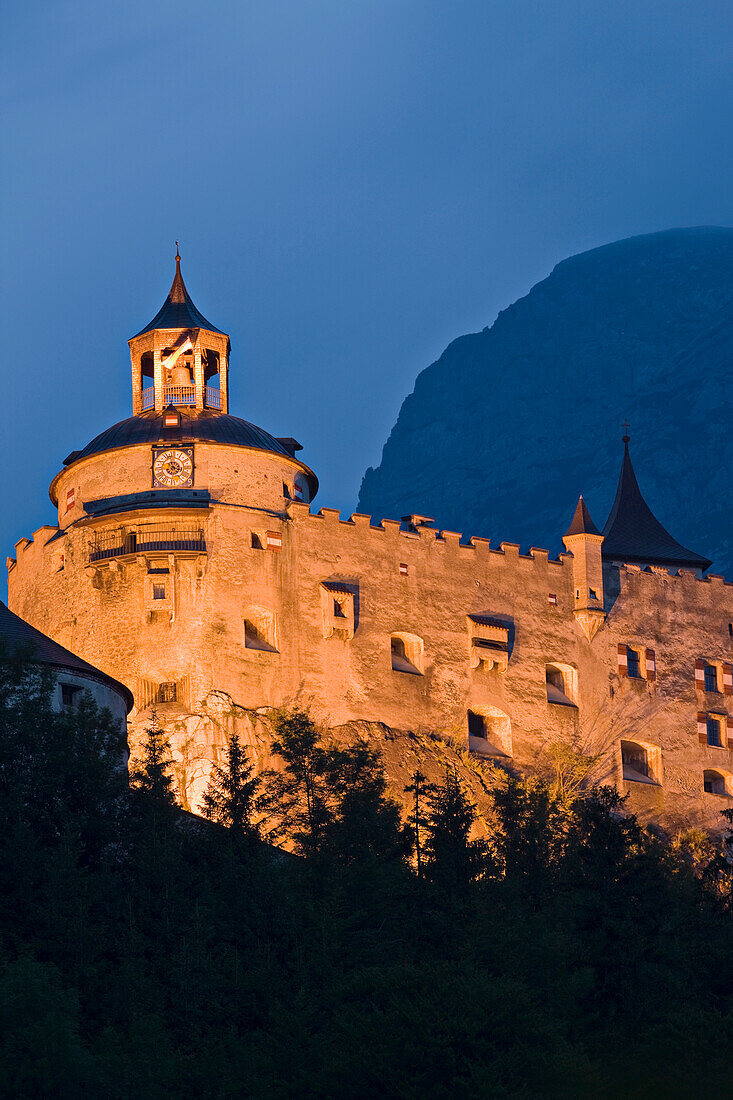 The illuminated Hohenwerfen castle in the evening, Werfen, Salzburg, Austria, Europe