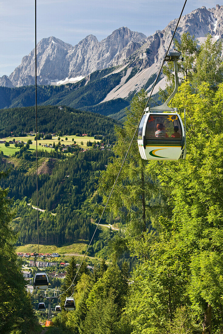 Overhead cablecar in front of southern face of Dachstein mountains, Styria, Austria, Europe