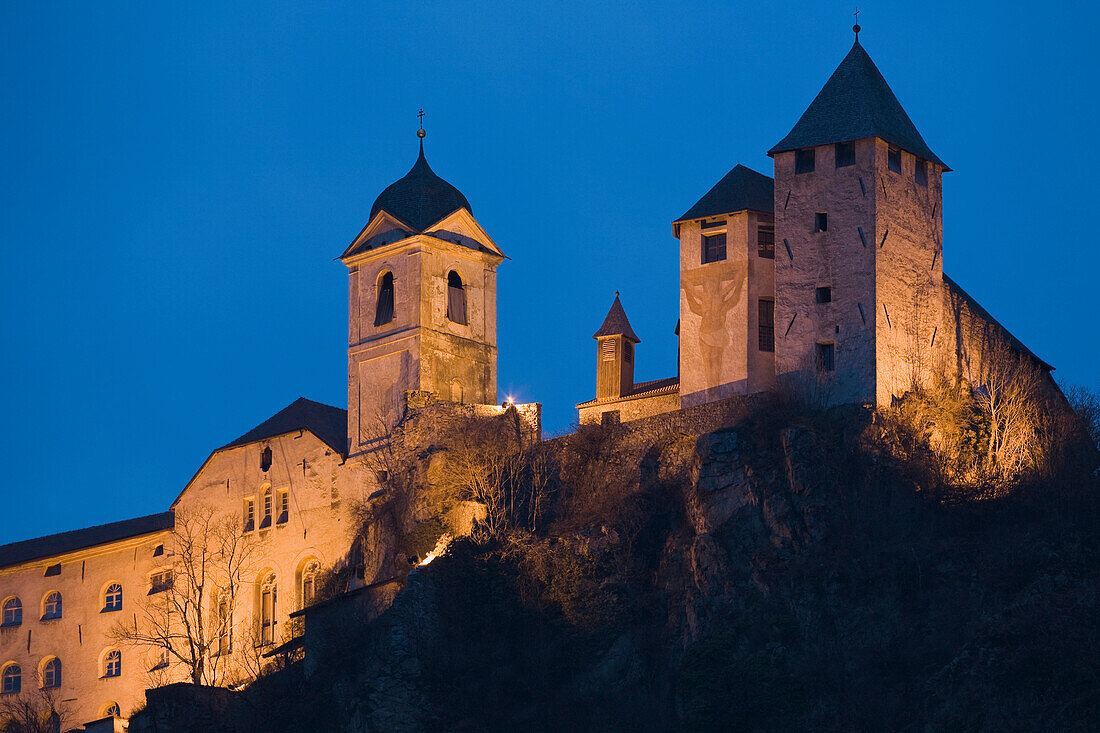 The illuminated Saeben monastery in the evening, Valle Isarco, Alto Adige, South Tyrol, Italy, Europe