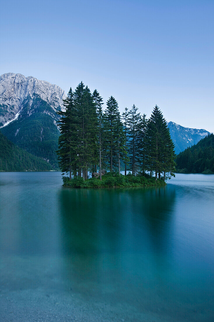 Island with trees on lake Predil, Lago del Predil, Julian Alps, Italy, Europe