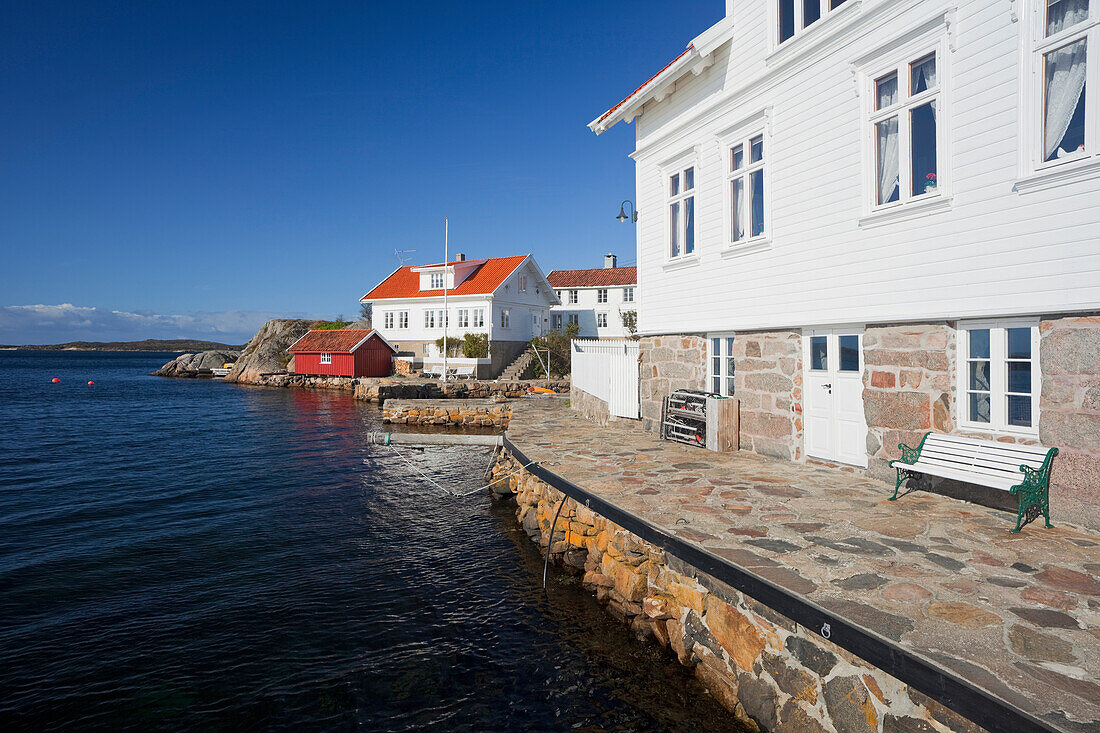 Houses along the coast in Loshamn harbour, Rogaland, Norway