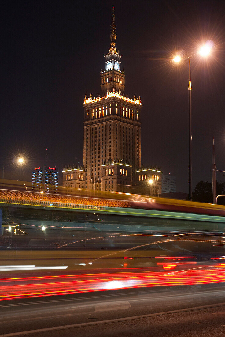 Communist era built Palace of Culture and Science at night, Warsaw, Poland