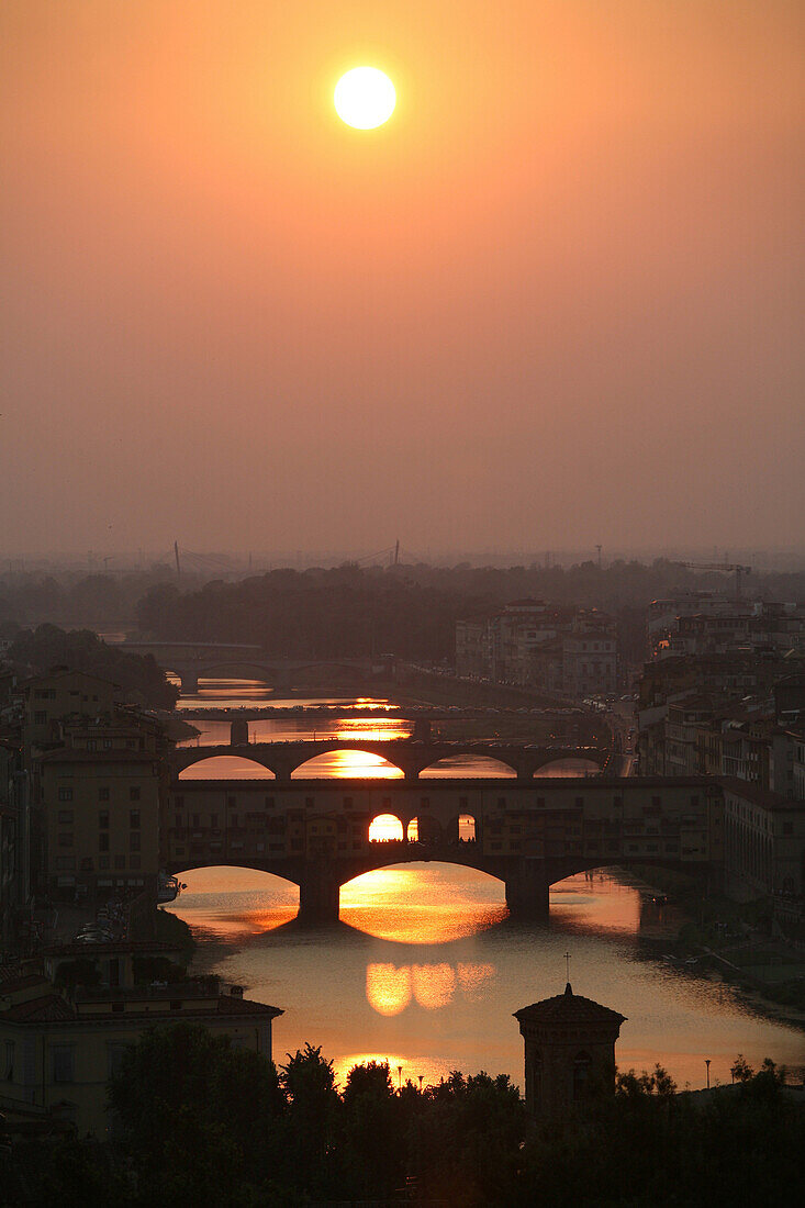 River Arno and Ponte Vecchio at sunset, Florence, Tuscany. Italy.
