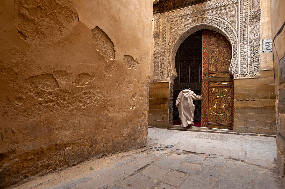 Man going into Sidi Tijani Mosque, Fez, Morocco