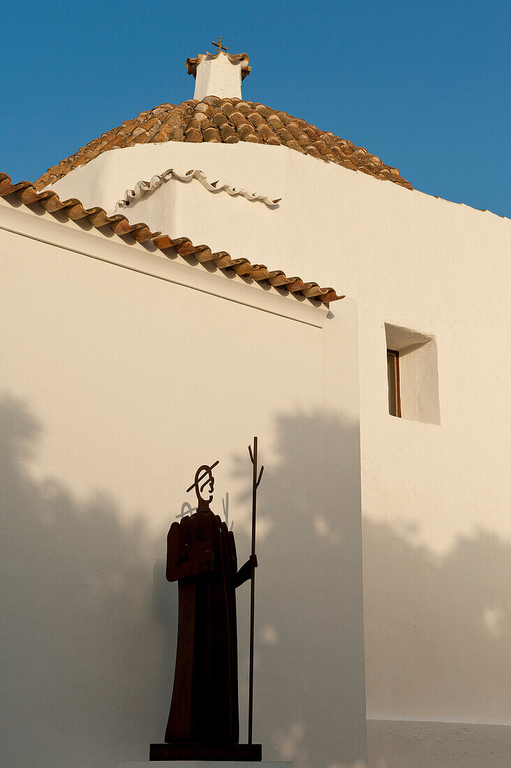 Statue of clergyman outside Sant Joan de Labritja church, Ibiza, Spain