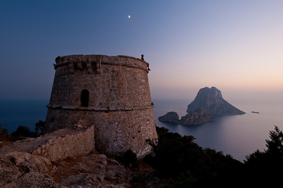 Torre des Savinar and Es Vedra island at dusk, Ibiza, Spain.