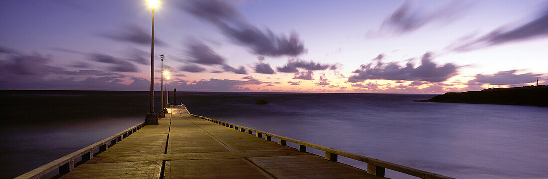 Pier and coastline just before dawn, East Coast, Barbados