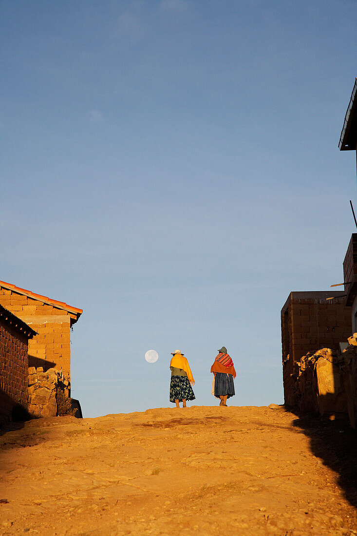 Amaryan woman walking down street on The Island of The Sun, Lake Titicaca, Bolivia