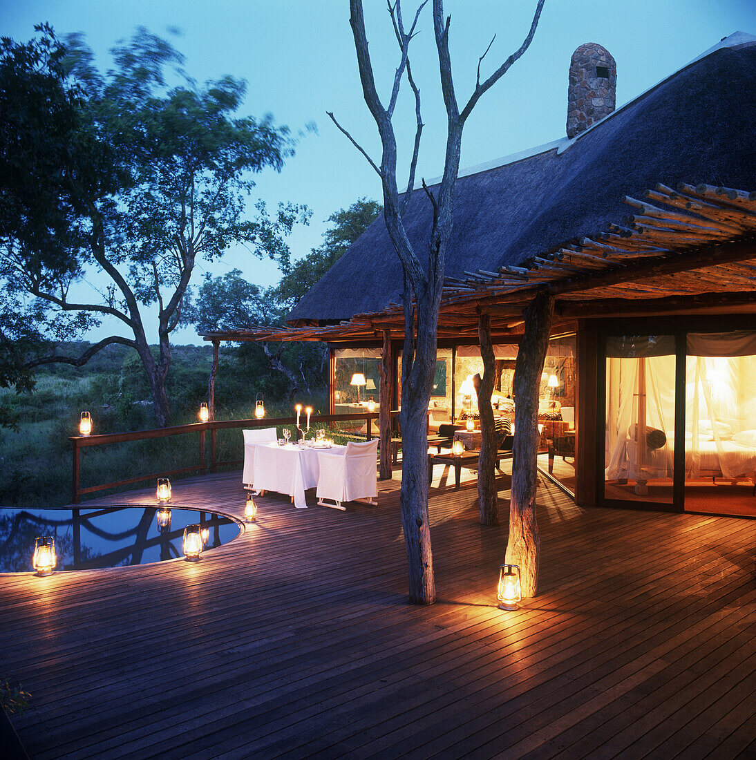 Romantic patio with lanterns, Luxury safari lodge, Singita Boulders, South Africa