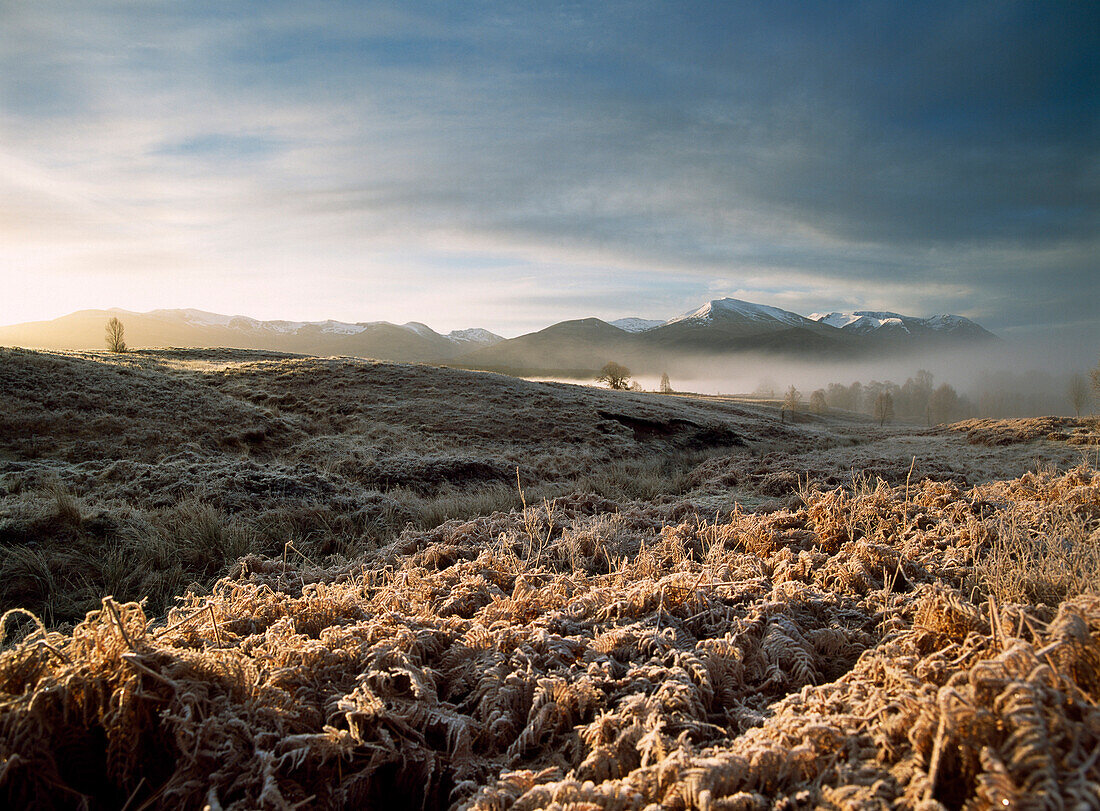 Looking across frosted fields and misty valley to Aonach Mor, Near Spean Bridge, Inverness-shire, Scotland