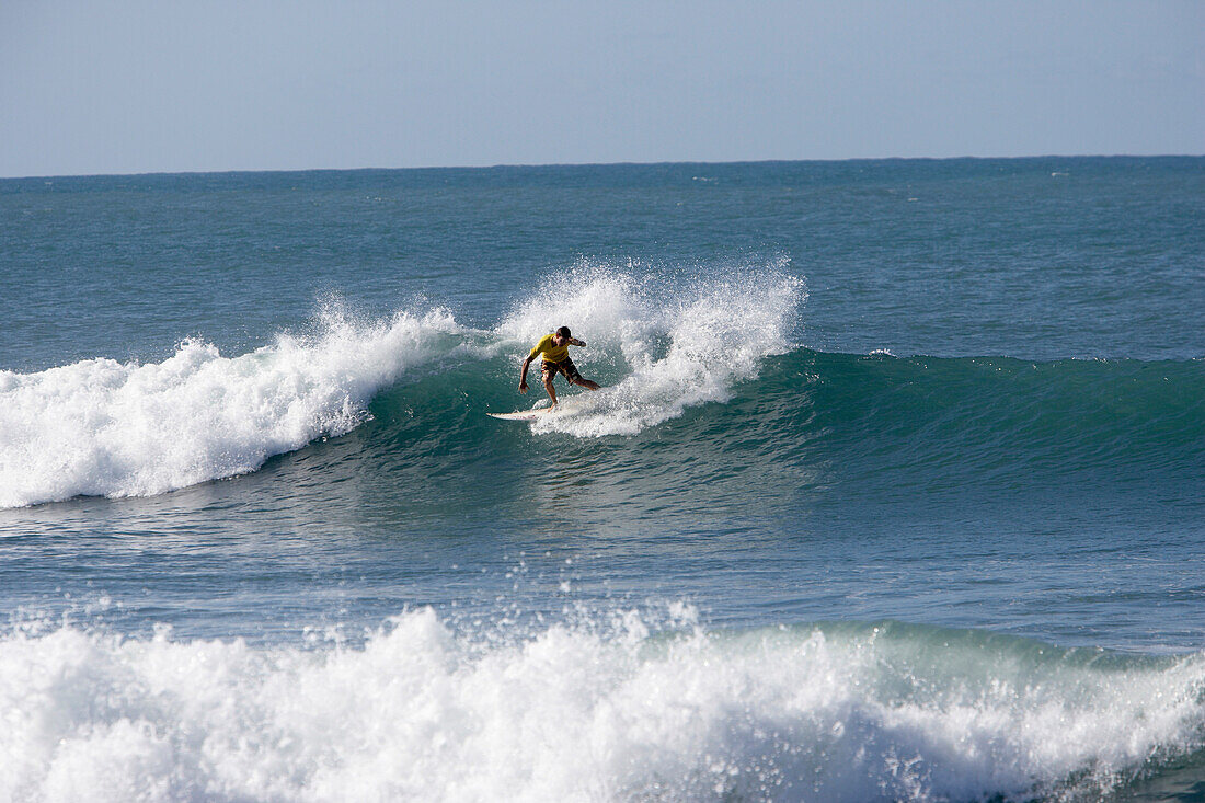 Surfer on big wave, Tanzania