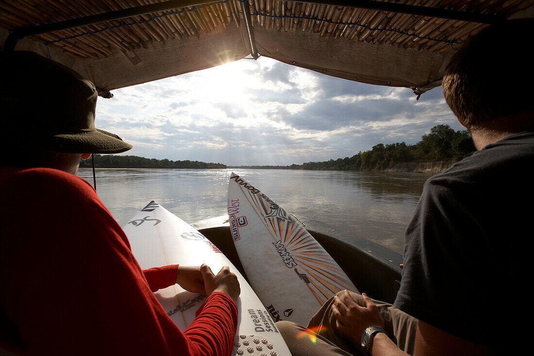 Travelling surfers on river in Tanzania, Tanzania, East Africa