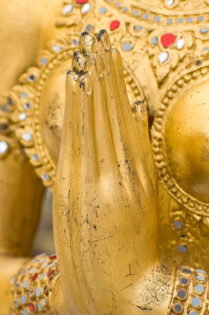 Detail of hands of statue at Wat Phra Kaew temple, Royal Palace complex, Bangkok, Thailand