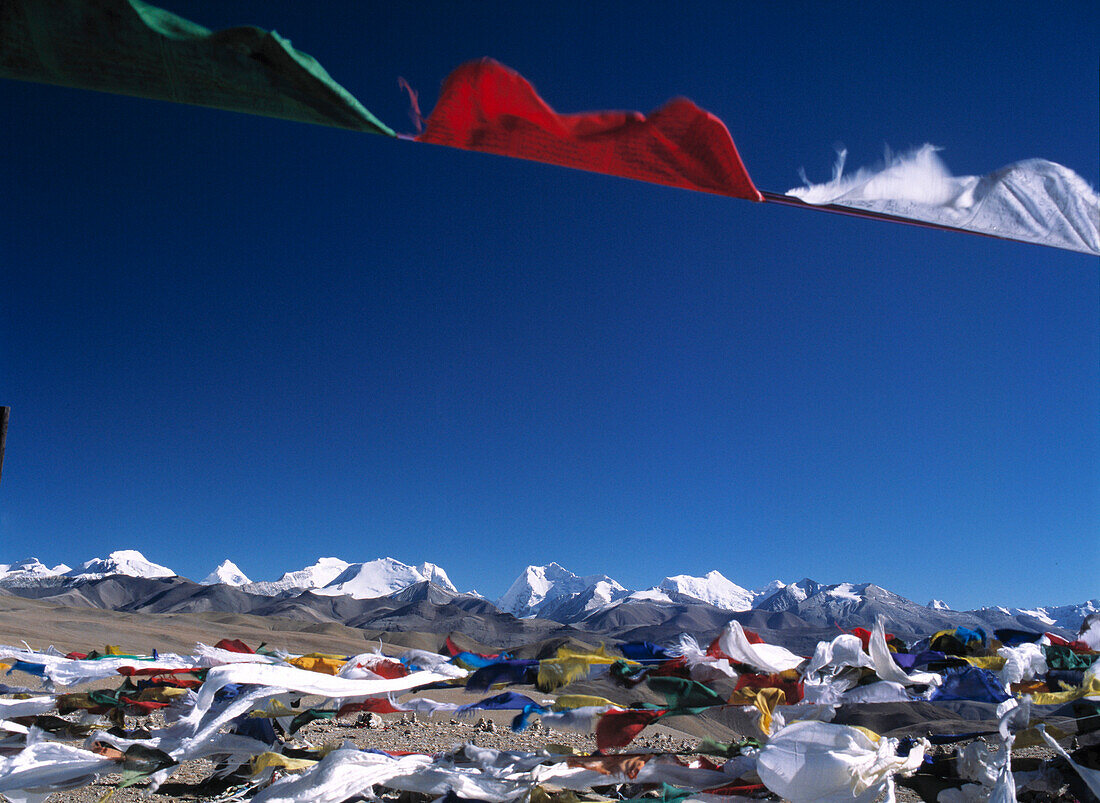 Prayer flags and Himalayas from the Tong La Pass, Friendship, Tibet