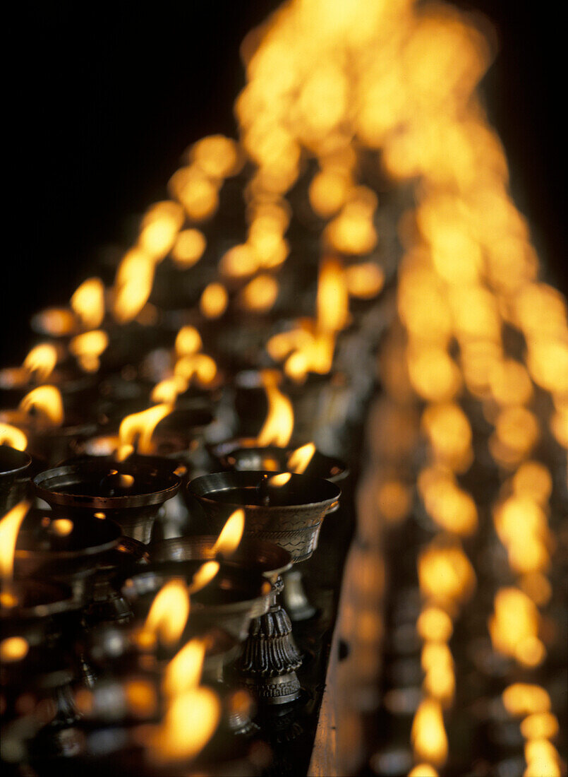 Butter lamps in the Jokhang Temple, Lhasa, Tibet.