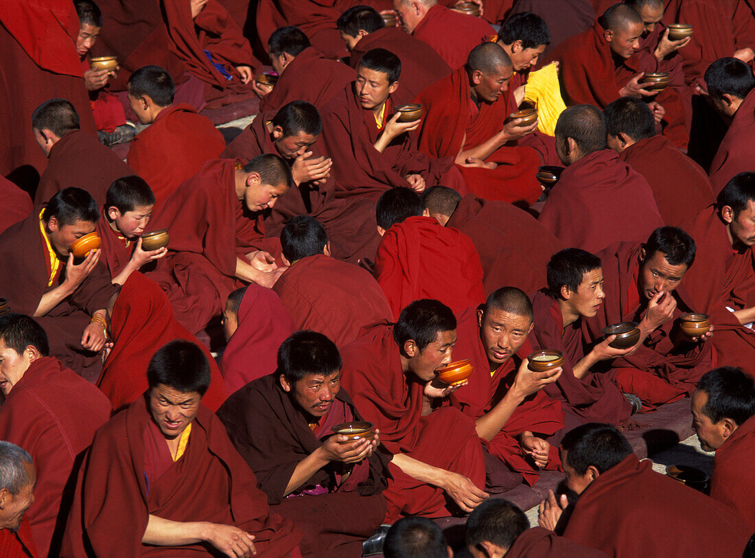 Monks drinking butter tea, Nechung Monastery, nr Lhasa, Tibet