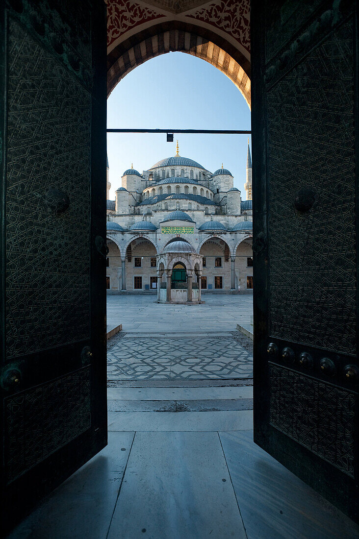 Courtyard of the Sultanahmet or Blue mosque at dawn, Istanbul, Turkey.