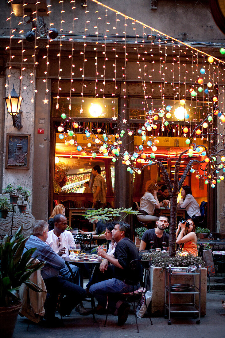 Outside dining at a restaurants on Jurnal Solak in Beyoglu, Istanbul Turkey