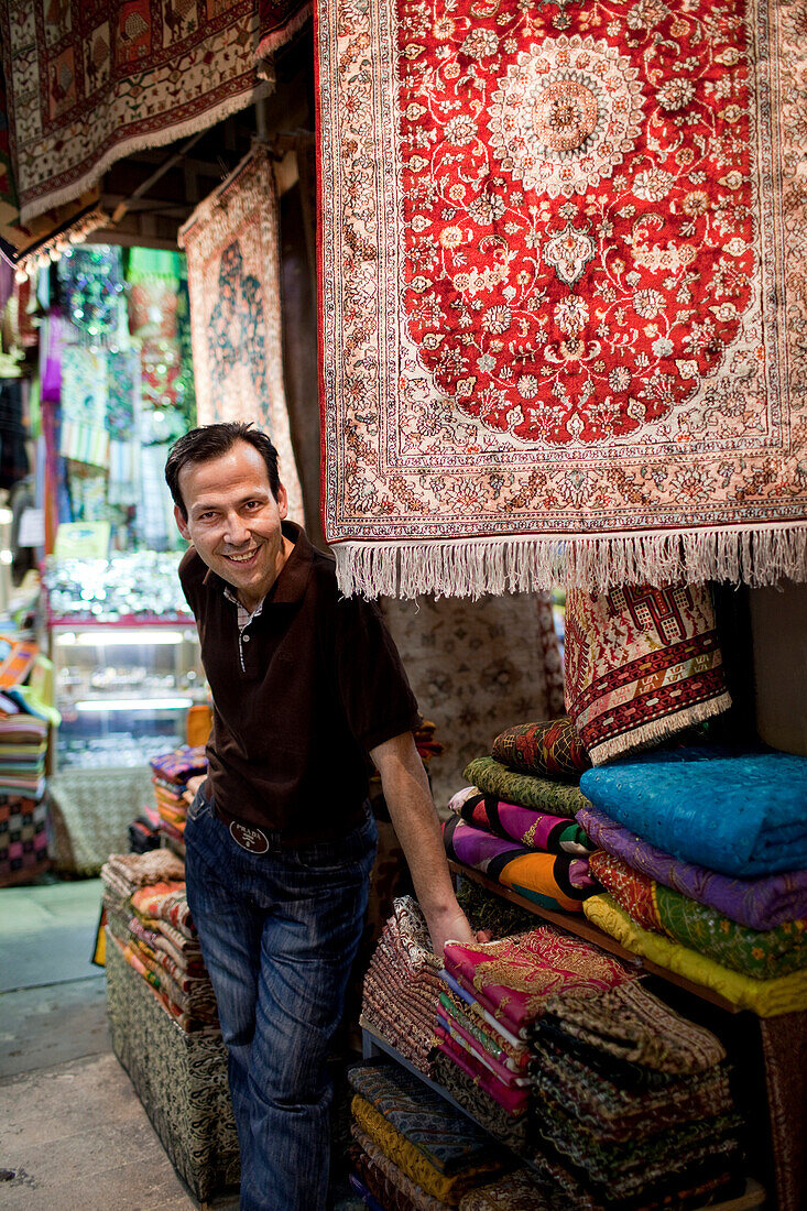 Carpet and rug vendor in the Kapali Carsi / Grand Bazaar in Beyazit, Istanbul Turkey