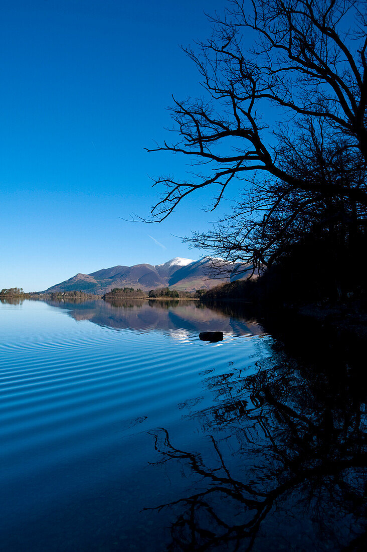 Ripples on calm waters of Derwent Water at dawn, Lake District, Cumbria, England, UK