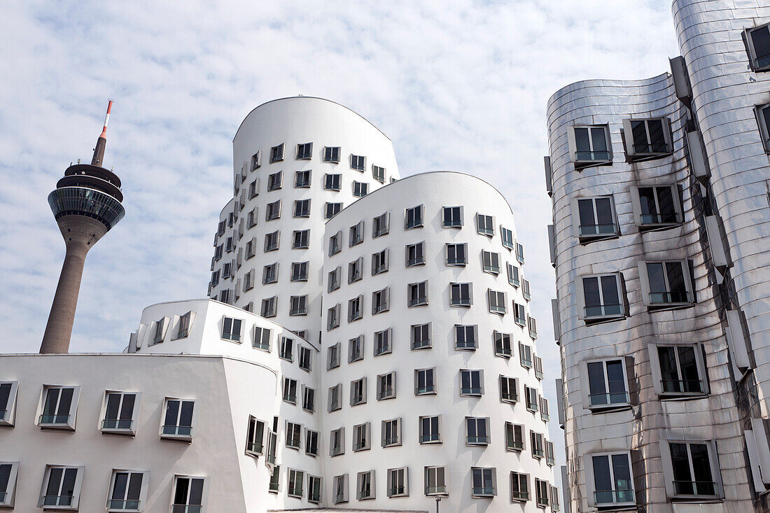The Rheinturm and Frank Gehry's Neuer Zollhof, Medienhafen, Düsseldorf, Germany, Europe
