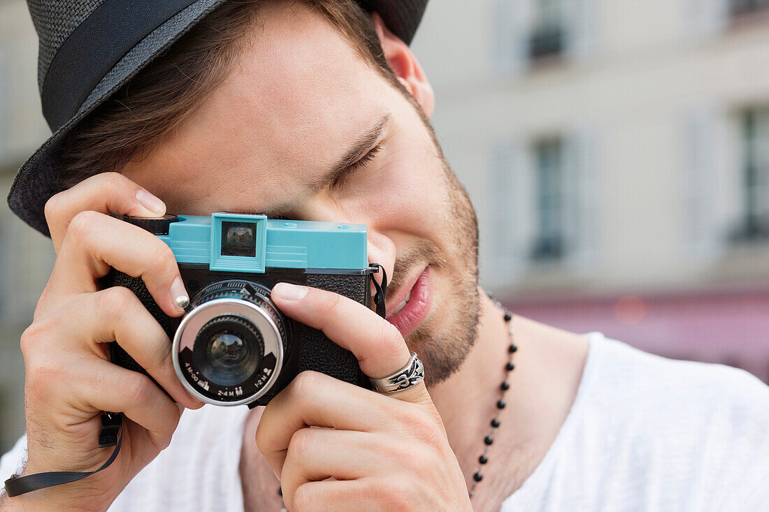 Man photographing with a camera, Paris, Ile-de-France, France