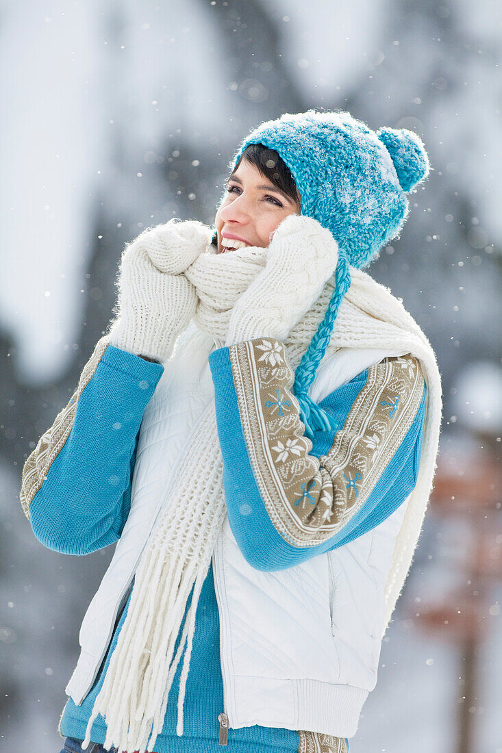Young woman in winter clothes smiling