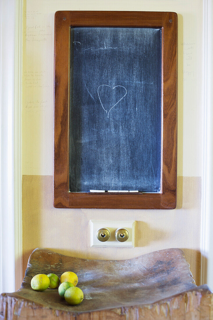 Details of blackboard with fruits kept on wooden stand