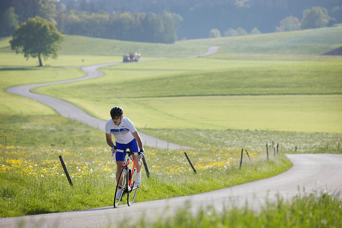 Cyclist near Muensing, Bavaria, Germany