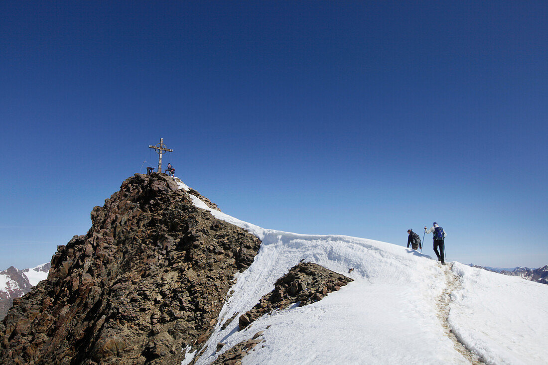Two mountaineers at the summit, Otztaler Alps, Tyrol, Austria