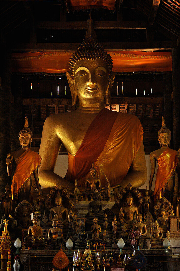 Big sitting Buddha and many small Buddha staues, Wat Wisunarat, Wat Visoun, Luang Prabang, Laos