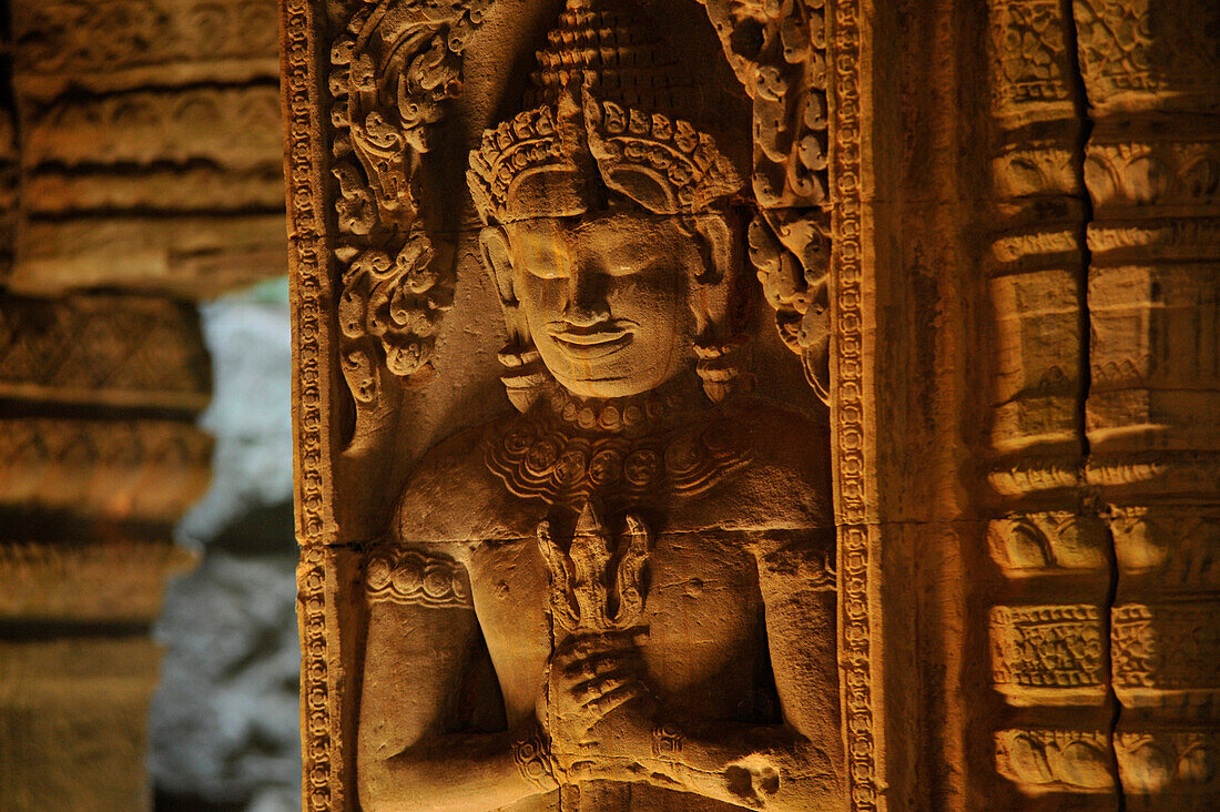 Stone relief of a deity inside Preah Khan, Angkor, Cambodia, Asia