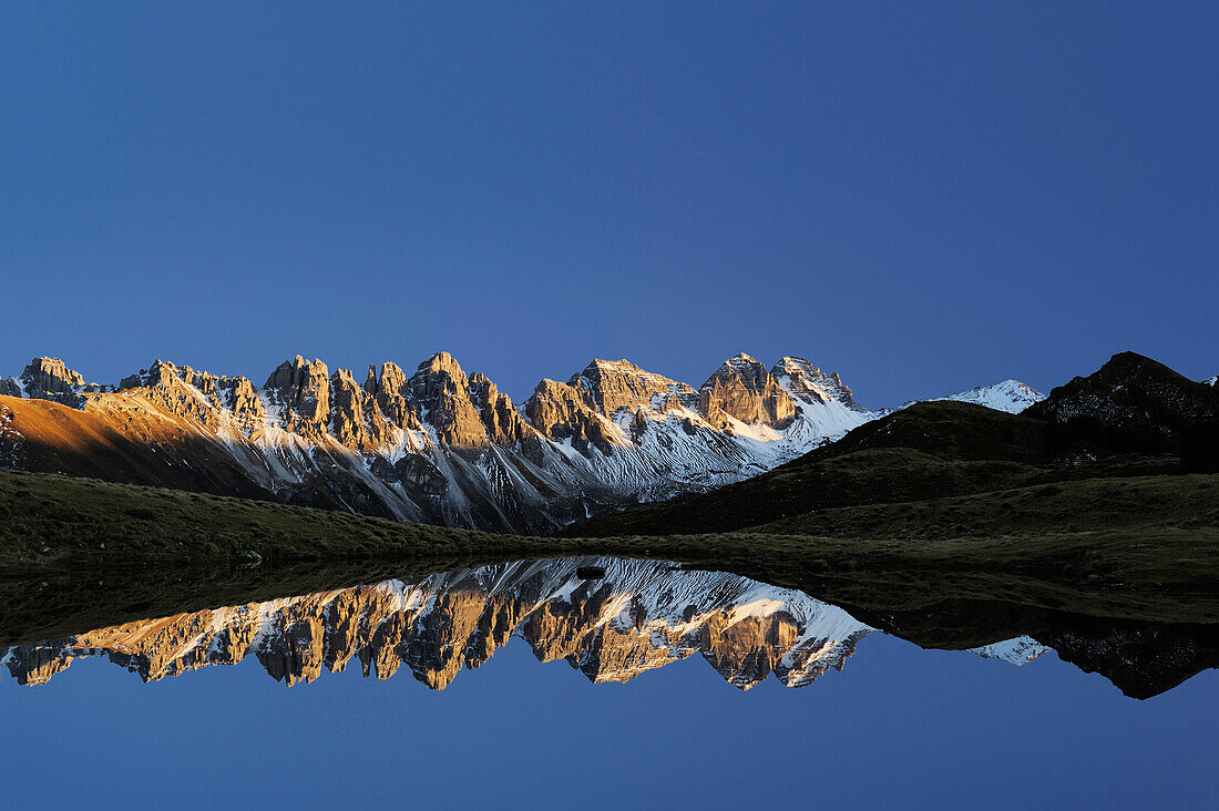 Kalkkoegel reflecting in a mountain lake, Salfains, Stubai, Stubai Alps, Tyrol, Austria
