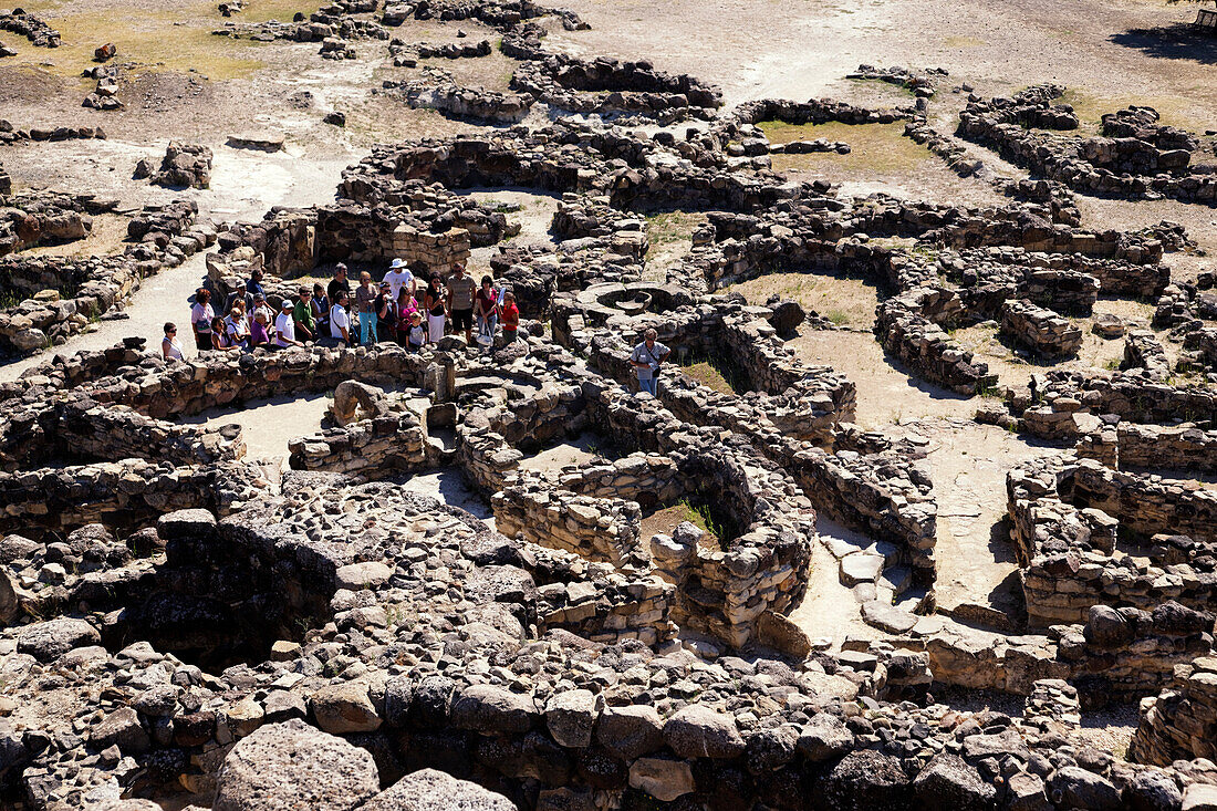 Tourists, at the ruins, Nuraghe Su Nuraxi, Barumi, Sardinia, Italy
