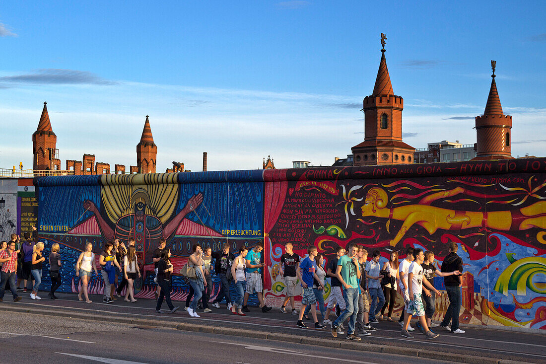 People in front of Berlin Wall mural, East Side Gallery, Berlin, Germany, Europe