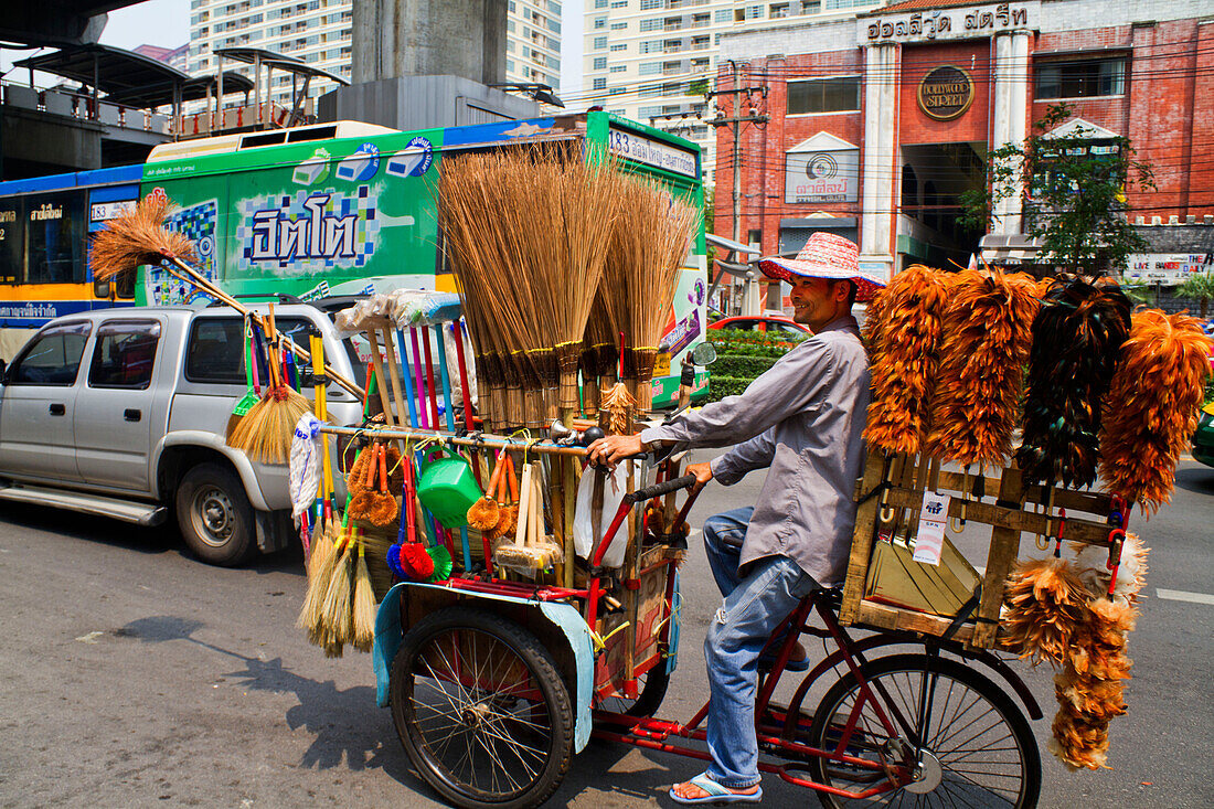 Mobile trader with feather dusters and brushes, Bangkok, Thailand, Asia