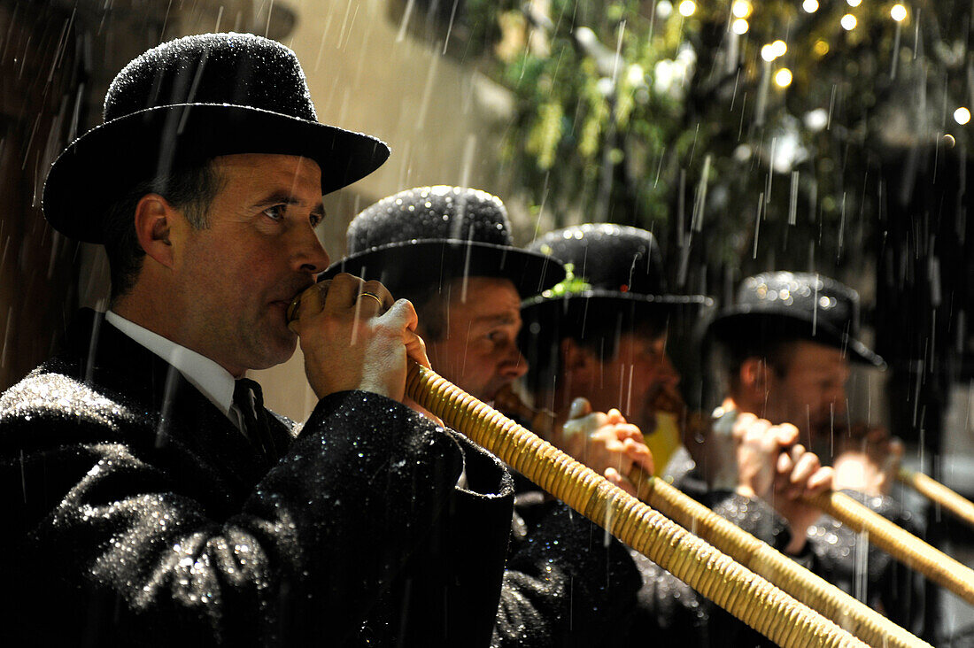 Musicians playing the alphorn in the rain, Alto Adige, South Tyrol, Italy, Europe