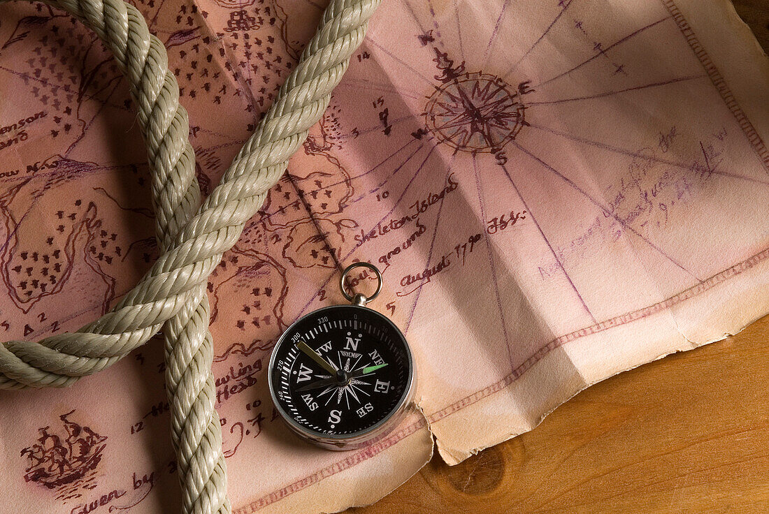 Marine map, compass and rope
