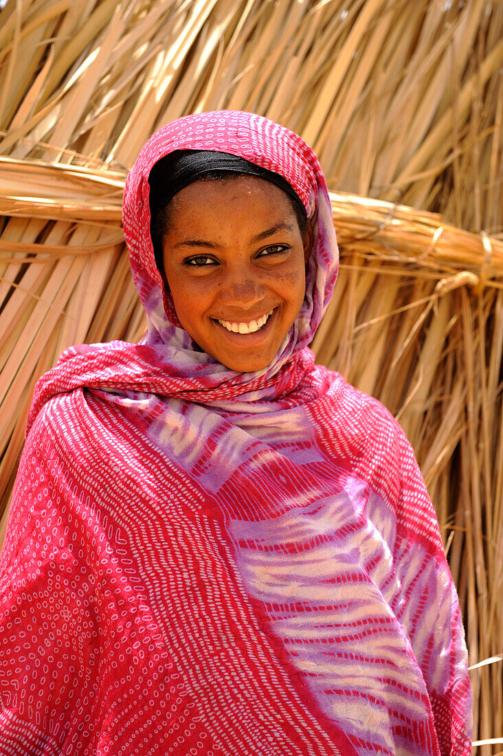 Algeria, region of Tamanrasset, Ahaggar desert, portrait of smiling tuareg woman