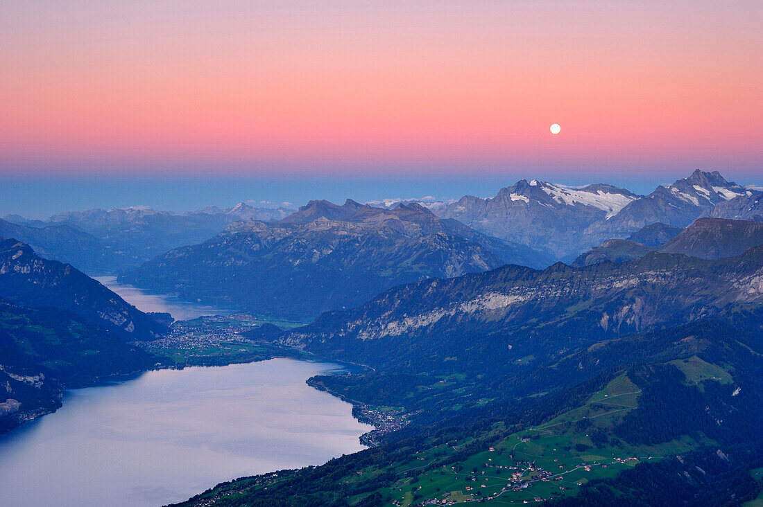 View from mount Niesen over Lake Thun to Wetterhorn with full moon, UNESCO World Heritage Site Jungfrau-Aletsch protected area, Bernese Oberland, canton of Bern, Switzerland