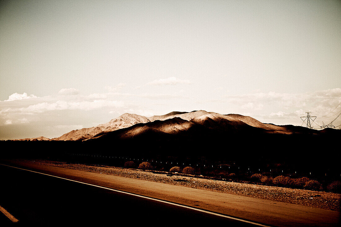 Shadow Covered Mountains Next to Highway, Nevada, USA
