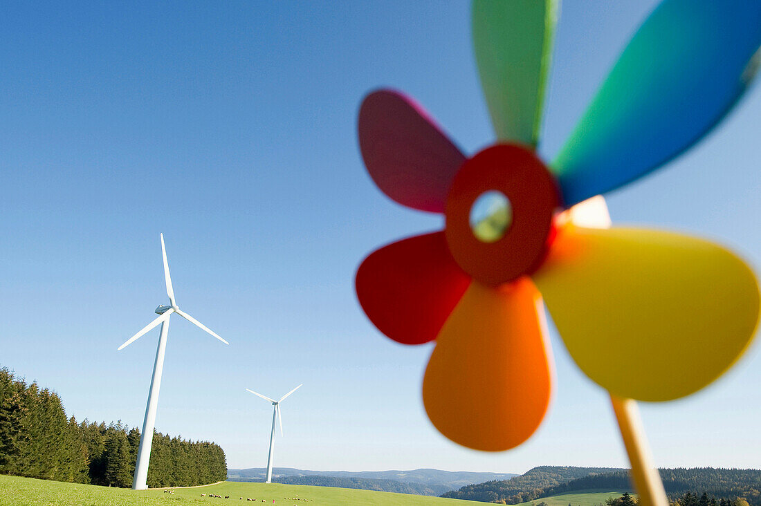 Toy windmill and large wind turbine, Black Forest, Baden-Wurttemberg, Germany