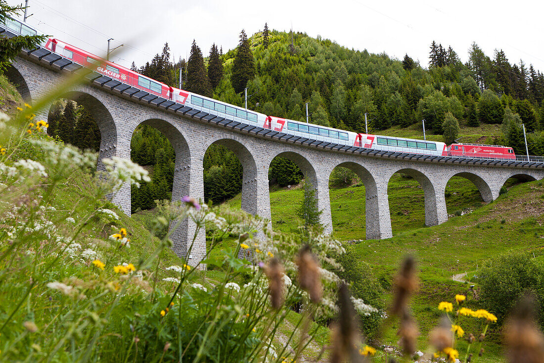 Train, Glacier Express, crossing the Bugnei Viaduct in Surselva, Graubuenden, Switzerland