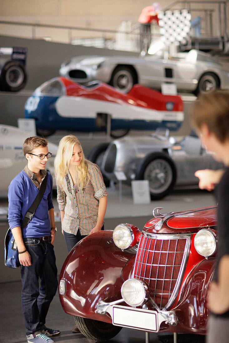 Students in the Transport Museum looking at an oldtimer, Deutsches Museum, German Museum, Munich, Bavaria, Germany