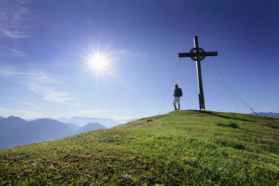 Hiker on the summit of Notkarspitz, Ammergau Alps, Upper Bavaria, Bavaria, Germany