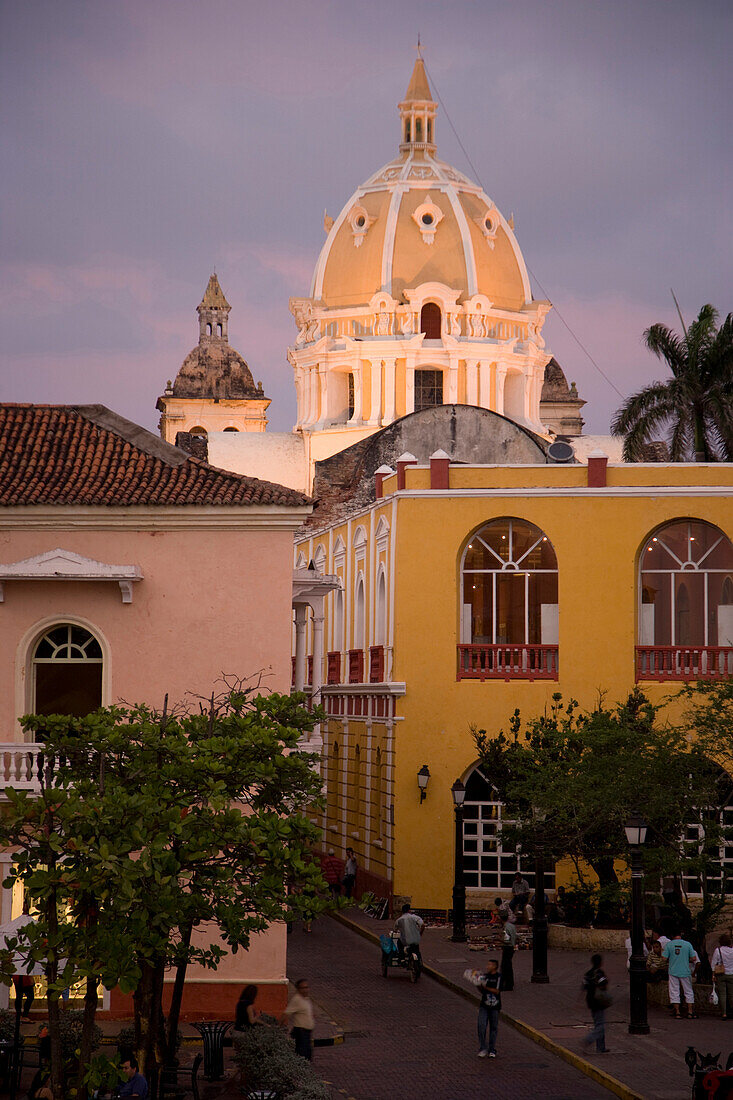 View of Cartagena after sunset with dome of San Pedro Claver in background, Cartagena, Colombia